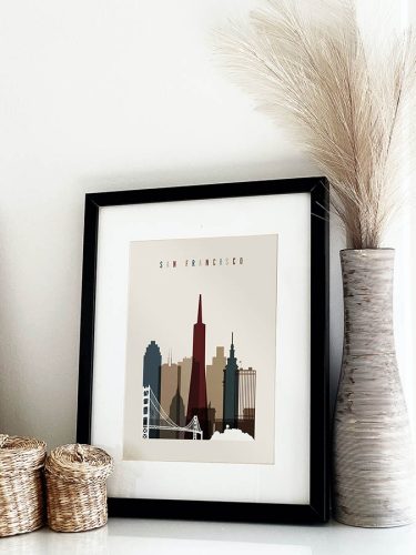 Framed art print of San Francisco skyline featuring notable buildings and the Golden Gate Bridge.