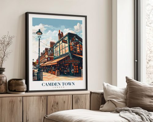 Framed print of Camden Town in London, showcasing a prominent building with a blue sky above.