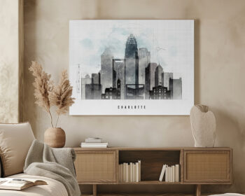 Artistic representation of the Charlotte skyline with buildings in shades of gray and blue.