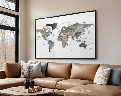 World map artwork in earth tones displayed in a framed format on a wall.