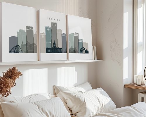 Three-panel art print of Edmonton's skyline with buildings in muted colors displayed on a shelf.