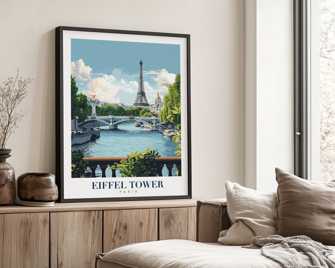 Art print of the Eiffel Tower with a bridge and trees in the foreground, framed and displayed indoors.