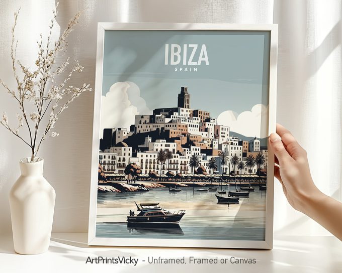 Framed artwork depicting the island of Ibiza, Spain with boats and a coastal view.