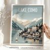 Art print of Lake Como, Italy, featuring mountains and buildings along the shore.