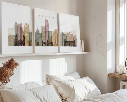 Three art prints depicting the skyline of Mexico City in muted colors displayed on a shelf.