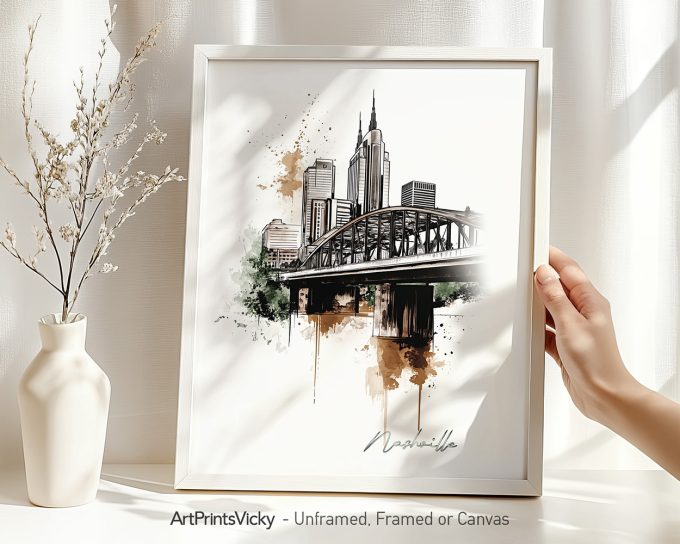Framed artwork depicting a cityscape of Nashville with a bridge and skyline.