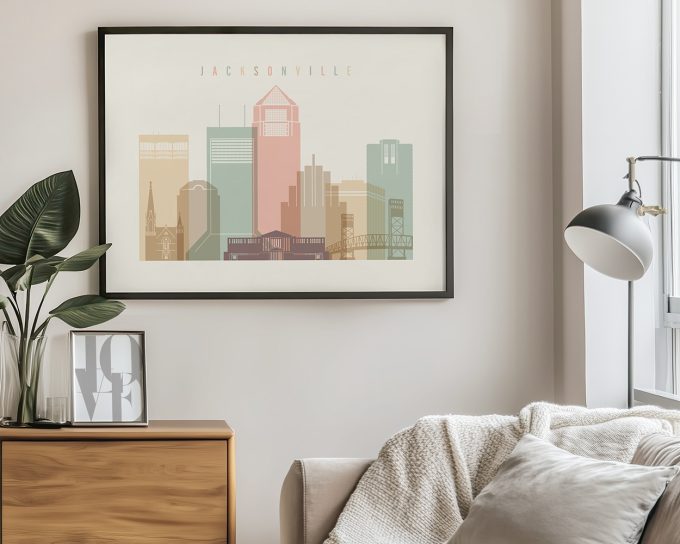 Framed artwork of Jacksonville city skyline with pastel colors and text 'Jacksonville'.
