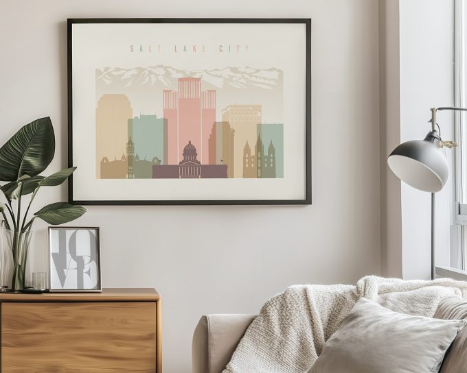 Art print of Salt Lake City skyline featuring buildings and mountains in pastel colors.