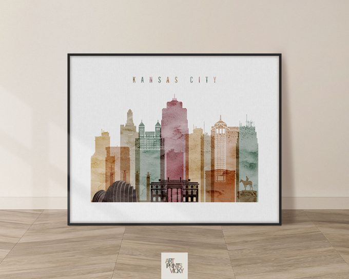 Art print featuring a stylized skyline of Kansas City with various building silhouettes and colors.