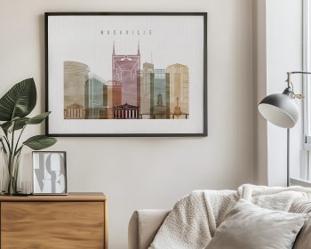 Framed artwork depicting a cityscape of Nashville with various building outlines and colors.