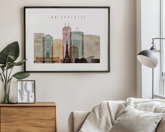 Framed artwork depicting a cityscape of Indianapolis with various buildings and landmarks.