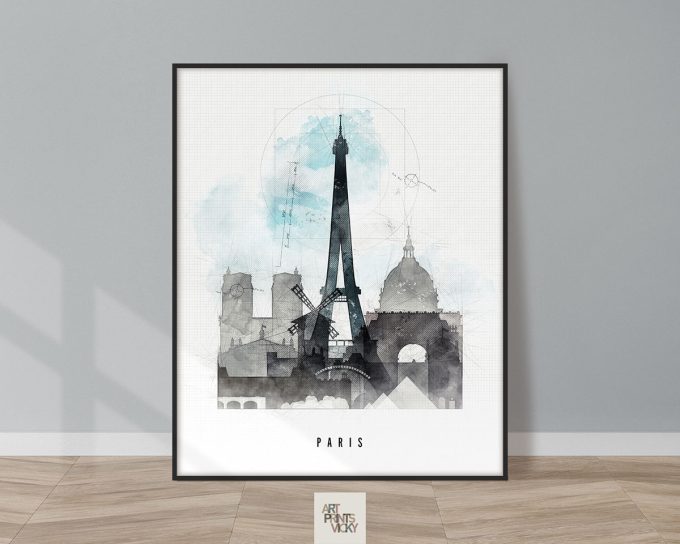 Framed artwork featuring the Eiffel Tower and other Parisian landmarks in a watercolor style.
