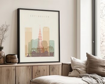 Framed print of a cityscape featuring buildings and a tower labeled 'Copenhagen'.
