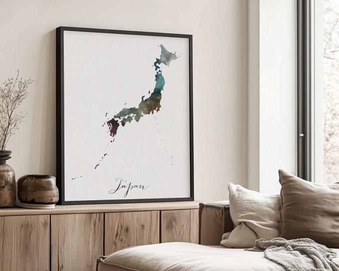Watercolor illustration of Japan's outline in various shades on a textured background.
