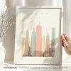 Art print of New York City skyline featuring iconic buildings and the Statue of Liberty.