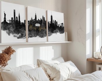 Triptych artwork featuring the New York City skyline with iconic landmarks in black and gold on a white background.