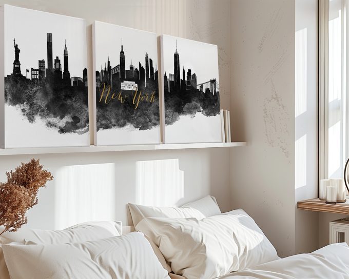 Triptych artwork featuring the New York City skyline with iconic landmarks in black and gold on a white background.