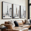 Three framed cityscape prints featuring Paris, London, and New York displayed on a wall above a sofa.