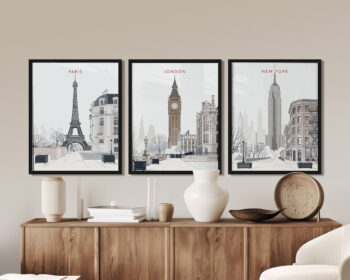 Framed prints of the Eiffel Tower, Big Ben, and the Empire State Building on a wall.