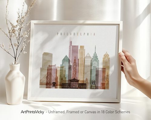 Framed artwork depicting a stylized cityscape of Philadelphia with notable buildings.