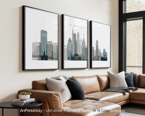 Three framed art prints depicting the Philadelphia skyline in a minimalist style.