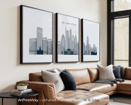 Three framed art prints depicting the Philadelphia skyline in a minimalist style.