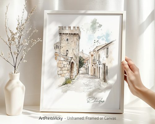 Framed watercolor drawing of a street scene in Rhodes with a tower and buildings.