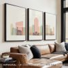 Three framed art prints depicting a stylized cityscape of Richmond with buildings in pastel colors.