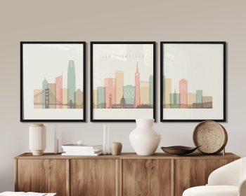 Three framed art prints depicting a stylized cityscape of San Francisco with notable buildings.