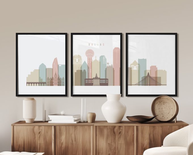 Three framed prints of a cityscape featuring Dallas with various buildings and structures in soft colors.