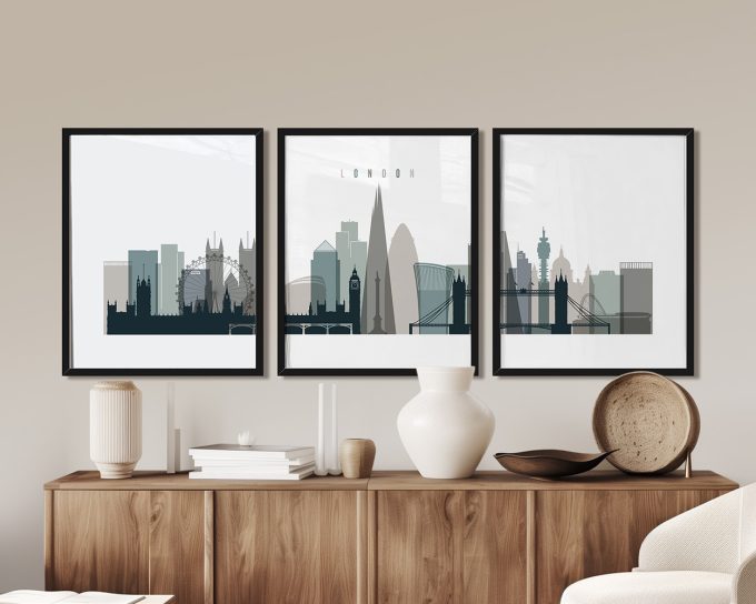 Three framed art prints of London's skyline featuring notable buildings and landmarks.