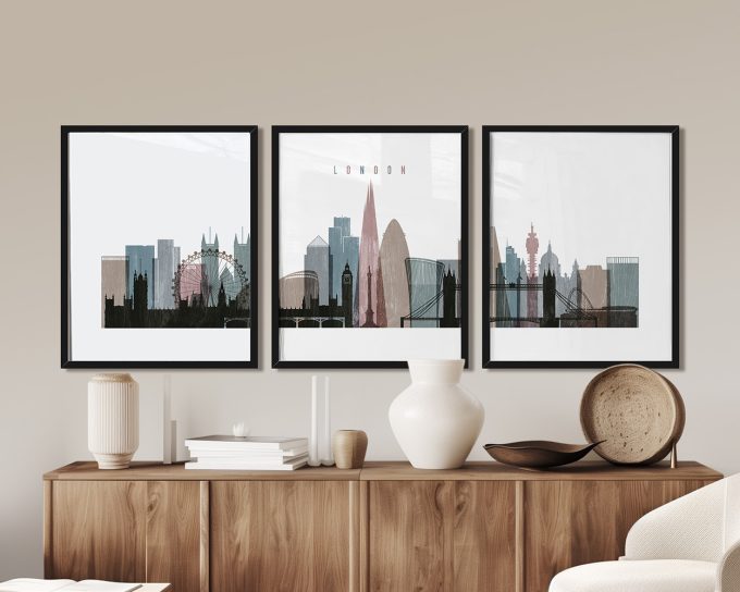 Three framed art prints of London's skyline featuring notable buildings and landmarks.