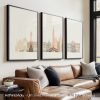 Three framed art prints depicting a stylized Venice cityscape with buildings in soft colors.