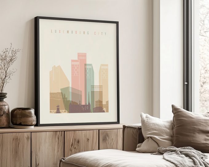 Framed art print of Luxembourg City featuring stylized buildings in pastel colors.