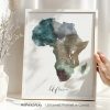 Watercolor map of Africa displayed in a frame with a neutral background.