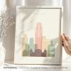 Framed artwork featuring a stylized skyline of Albany with pastel colors and the text 'ALBANY'.