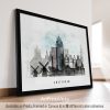 Framed artwork depicting a cityscape of Amsterdam with buildings and windmills.