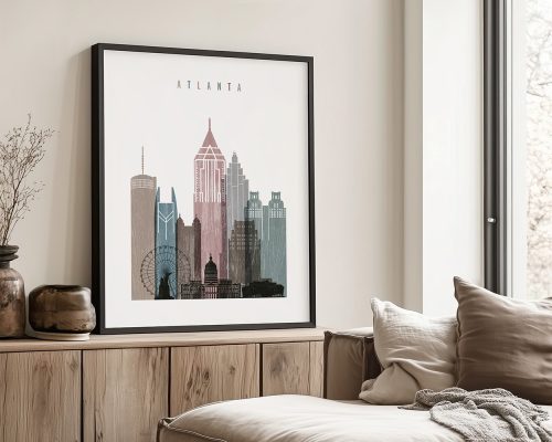 Framed artwork depicting a cityscape of Atlanta with various buildings and landmarks.