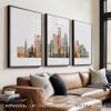 Three framed art prints depicting the skyline of Austin, Texas, in various colors and styles.