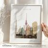 Art print featuring a silhouette of Berlin's skyline with notable landmarks in various colors.
