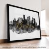 Art print featuring a silhouette of the Boston skyline with the word 'Boston' in gold lettering.