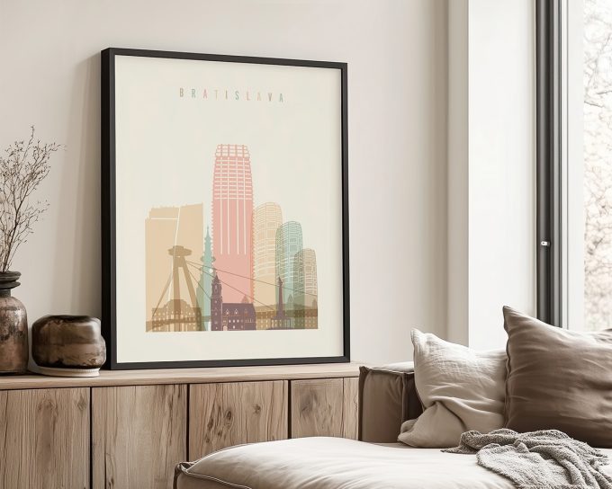 Framed print of Bratislava cityscape featuring notable buildings and structures in pastel colors.