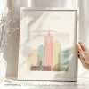 Art print of Cape Town featuring stylized buildings and mountains in pastel colors.