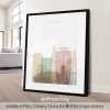 Framed artwork featuring a stylized cityscape of Cardiff with notable buildings and landmarks.