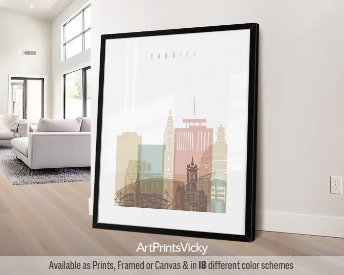 Framed artwork featuring a stylized cityscape of Cardiff with notable buildings and landmarks.