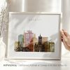 Framed artwork of Cardiff cityscape featuring notable buildings and landmarks in a colorful design.