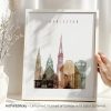 Art print featuring the skyline of Charleston with various architectural silhouettes in soft colors.