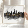 Art print featuring the skyline of Charlotte with the word 'Charlotte' in gold lettering.