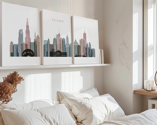 Three art prints of the Chicago skyline displayed on a shelf above a bed.