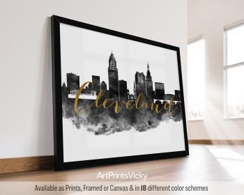 Framed print of the Cleveland city skyline with the word 'Cleveland' in gold lettering.